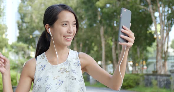 Woman having video call on cellphone 