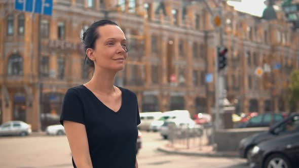 Female Walks on the Street in Town