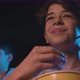 Boy watching a comedy movie at the cinema, he is eating popcorn and smiling - VideoHive Item for Sale