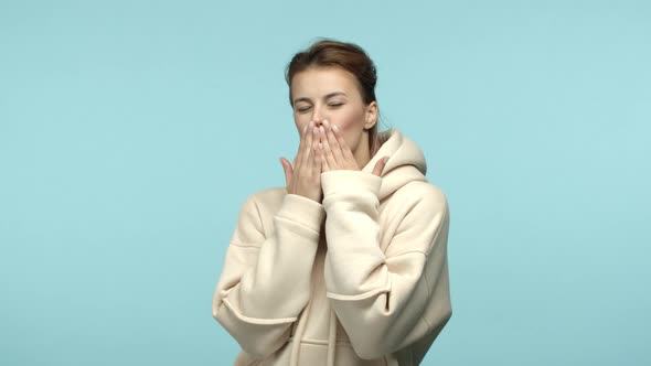 Slow Motion of Lovely Young Woman in White Hoodie Blowing Air Kisses at Camera and Smiling Express