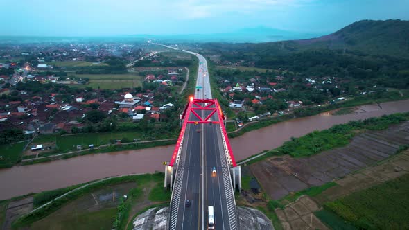 Aerial view of the Kalikuto Bridge, an Iconic Red Bridge at Trans Java Toll Road