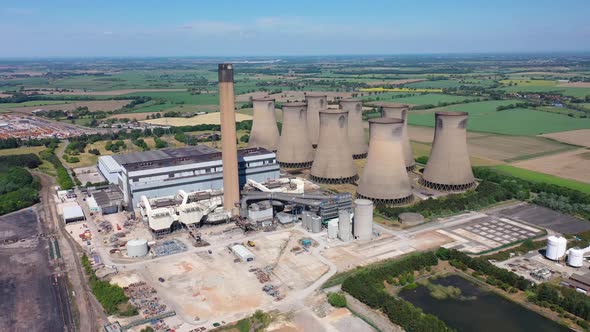 Aerial footage of the Eggborough Power station showing the eight cooling towers and chimneys 