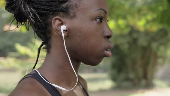young black american athlete getting ready to ride wearing headphone-slow motion