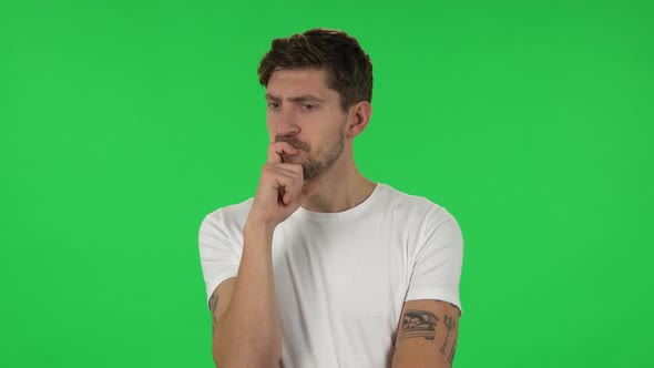 Portrait of Confident Guy Is Thinking About Something, and Then an Idea Coming To Him. Green Screen