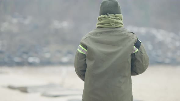 Beautiful Caucasian Confident Female Soldier Turning From Camera and Walking To Shooting Place on