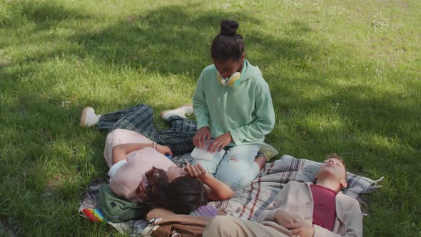 Kids Relaxing in Park in Summer