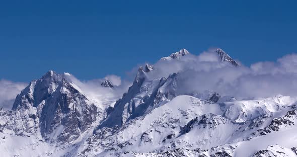 Timelapse of clouds flowing over a mountain range