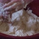 Baker hands kneading dough in flour on the ground. - VideoHive Item for Sale