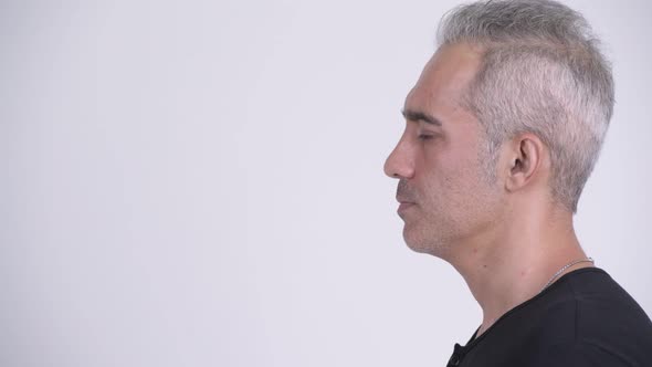 Profile View of Handsome Persian Man Against White Background