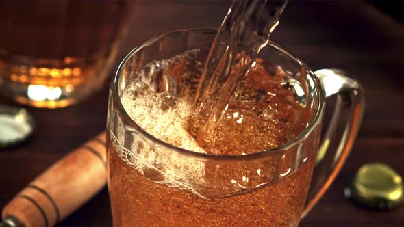 Super Slow Motion Beer Pours Into a Glass with Air Bubbles