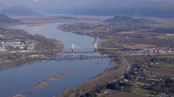 Aerial View Of Pitt River Bridge And Canadian Pacific Railway Spanning Between Port Coquitlam And Pi