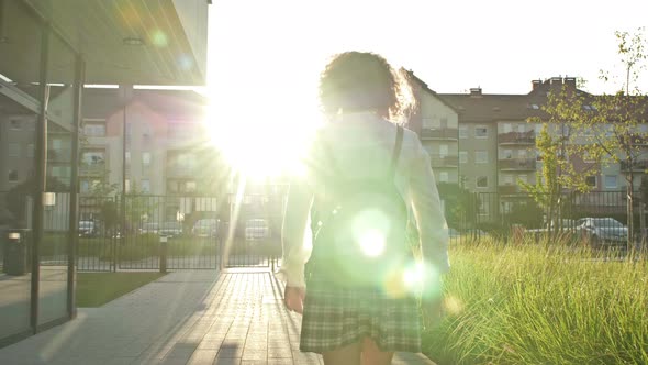 Teenage Schoolgirl College Student or High School Student is Returning From Class