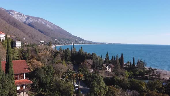 Mountains and sea. Lovely landscape. Blue sea water. Palm trees and sea.