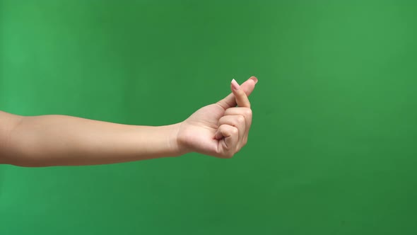 Hand Signs Gesture To Be Little Heart From Tip Of Thumb And Index Finger On Green Screen Background