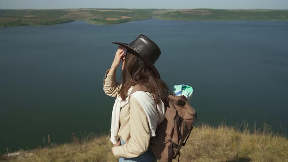 Positive Woman with Backpack Hiking at Bakota Area