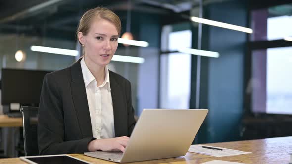 Attractive Young Businesswoman Saying No By Finger in Office