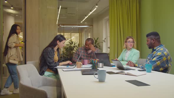 Female Employee Being Late for Business Meeting