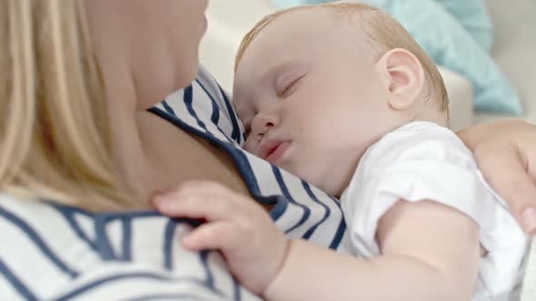 Baby Son Napping on Mother