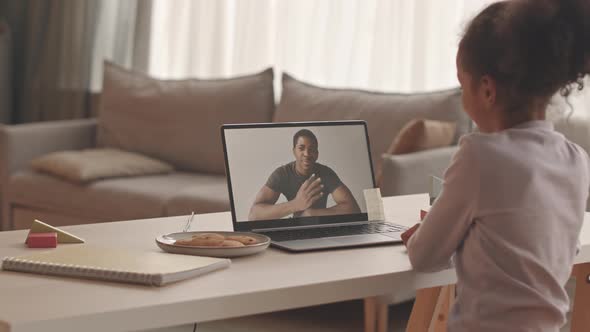 Little Girl Video Chatting with Military Father alt