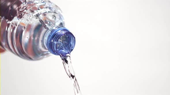 Super Slow Motion From the Bottle Pours a Stream of Water