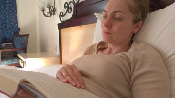 Woman On Bed With Book