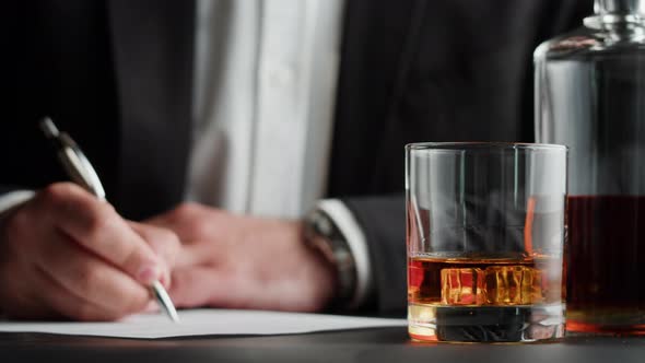 Businessman Drinking Brandy or Whiskey Closeup