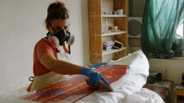 Woman making surfboard 4k