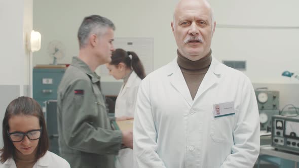 Scientist standing in the laboratory and giving a speech