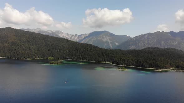 beautiful drone video of an lake and mountains, eibsee in bavaria