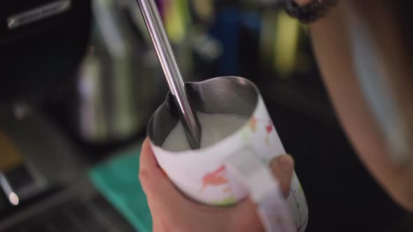 Closeup Steaming Milk in Cafe with Coffee Machine Steam Wand in Slow Motion