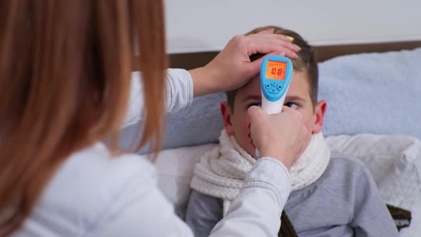 Woman Measures High Body Temperature in Fahrenheit with Noncontact Thermometer To Her Unhealthy Male