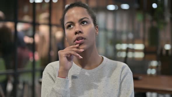 Pensive African Woman Thinking New Idea