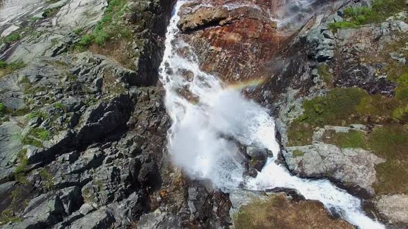 Breathtaking aerial footage of tall waterfall in Norway from above