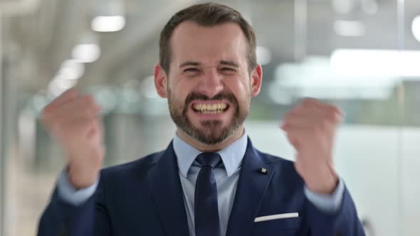 Portrait of Excited Businessman Celebrating Success