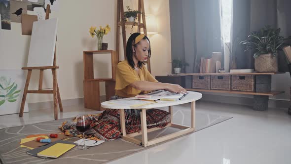 Young Woman Working with Color Palettes at Home