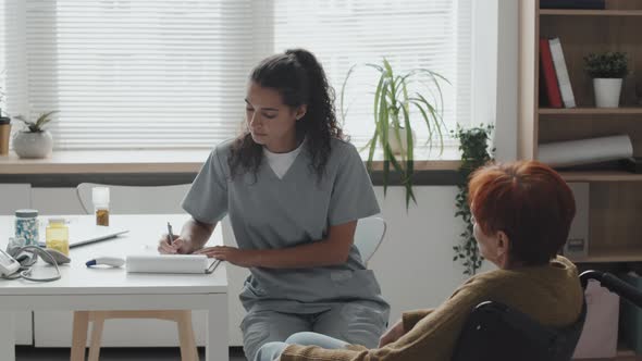 Senior Woman in Wheelchair at Doctors Appointment