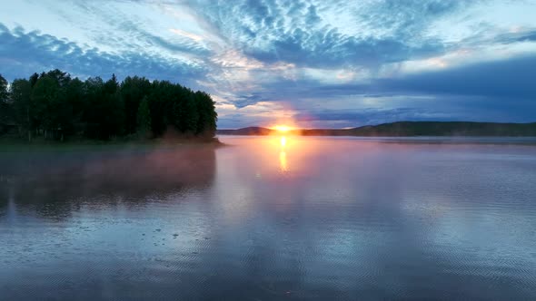 Aerial view of a lake at sunset in Overtornea, Sweden.