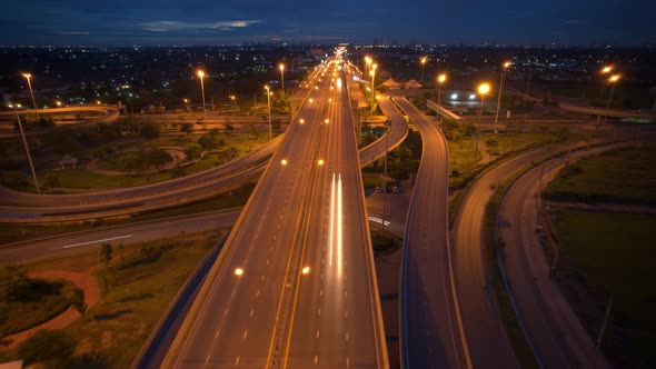 Aerial view shot of fast moving above interchange and multi junction road