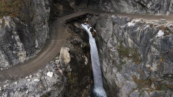 Aerial view of the Chame Waterfall flowing into the Marsyangdi River