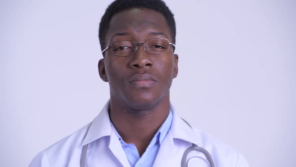 Face of Young Handsome African Man Doctor with Eyeglasses