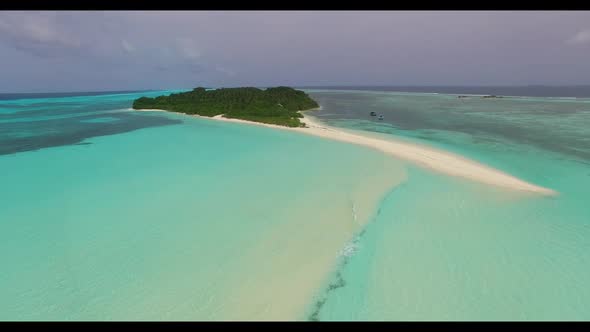 Aerial drone panorama of tranquil island beach vacation by blue sea with white sandy background of j