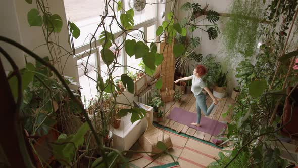 High Angle View of Woman Doing Lord of the Dance Pose while Practicing Yoga