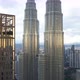 Aerial Footage of the Sunset Reflected in Petronas Twin Towers, Drone Goes Upwards the Building - VideoHive Item for Sale