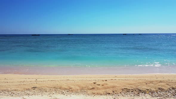 Beautiful above abstract shot of a white sandy paradise beach and blue ocean background in high reso