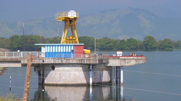 Ravens Fly Over Special Structure on Water Reservoir By Dam