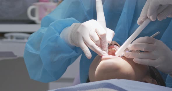 Woman checking on her teeth at dental clinic