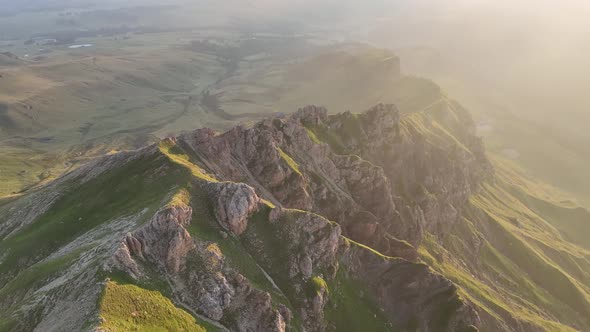 Sunrise in the Dolomites mountains with fog and mist