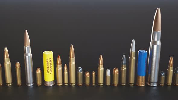 An endless row of different ammunition types standing on the ground in a loop.