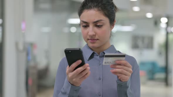 Portrait of Indian Woman with Unsuccessful Online Payment on Smartphone