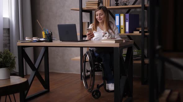 Handicapped Woman Reading Funny Content on Phone